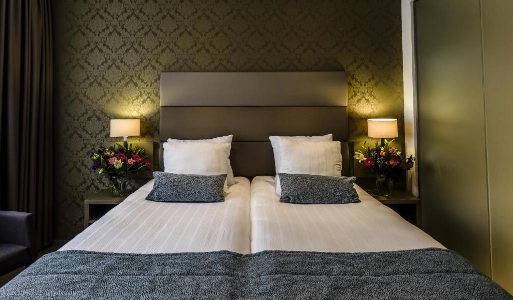 Een bed of bedden in een kamer bij OZO Hotels Arena Amsterdam