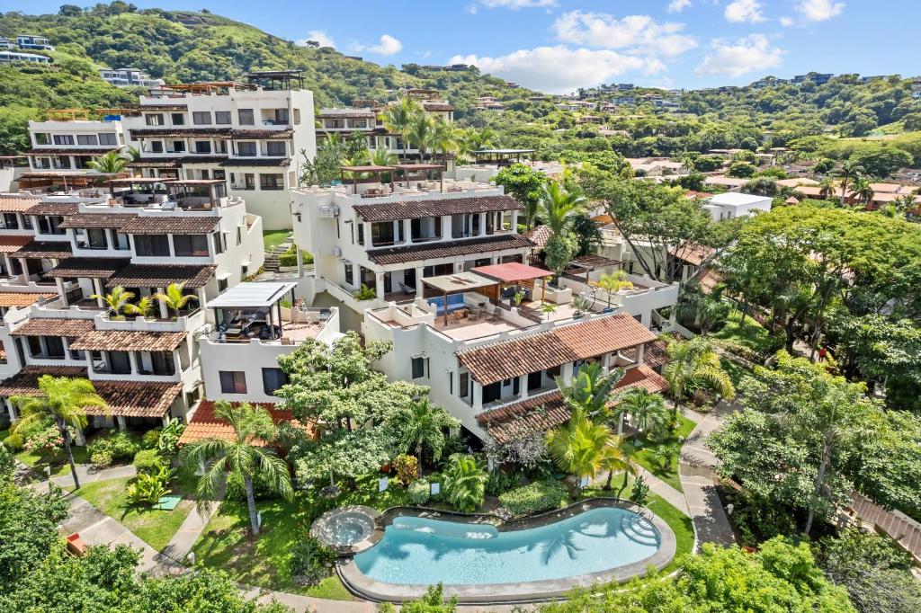 an aerial view of a resort with a swimming pool at Tropical Gardens Suites and Apartments in Coco