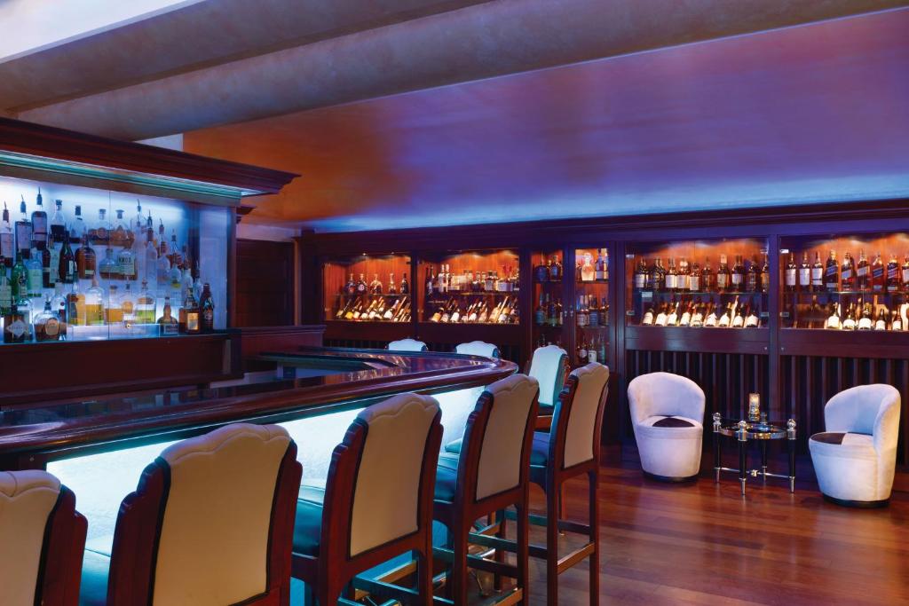 a bar with a row of chairs in a room at Harrah's Lake Tahoe Hotel & Casino in Stateline