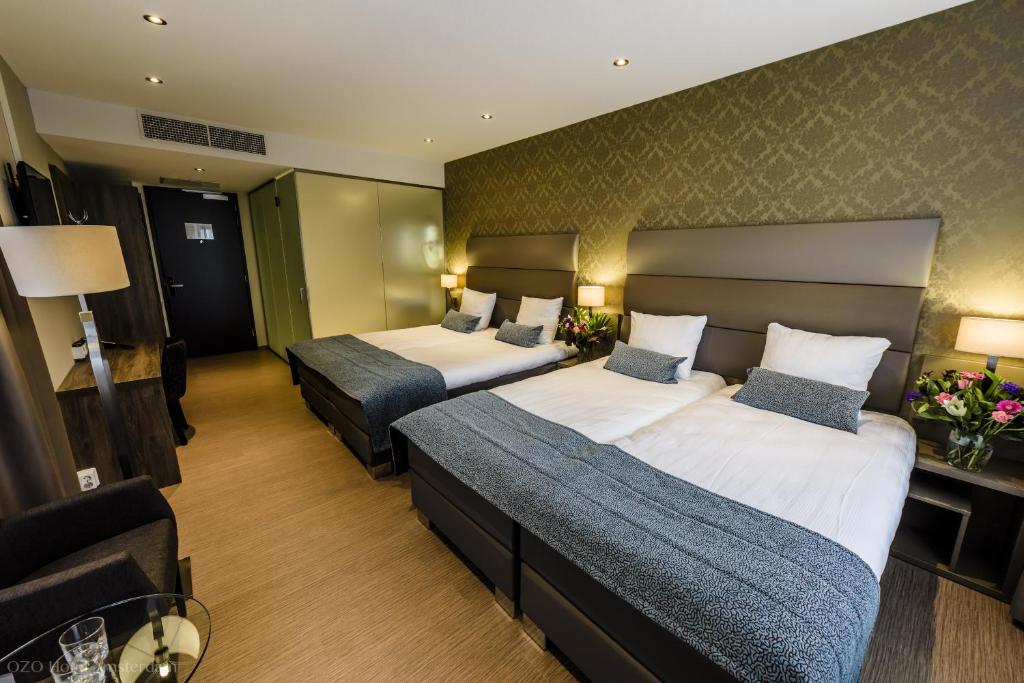 Een bed of bedden in een kamer bij OZO Hotels Arena Amsterdam