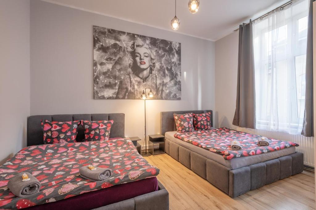Posteľ alebo postele v izbe v ubytovaní 70s Guest room