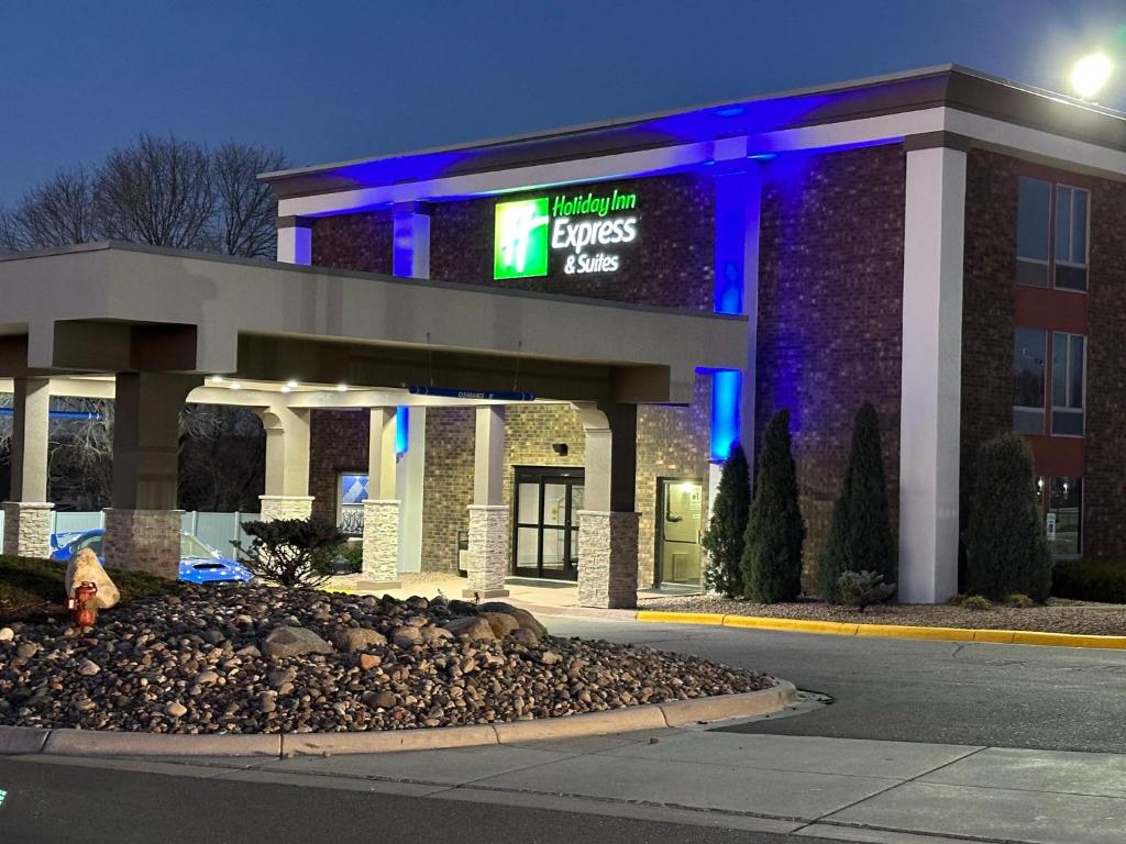 a building with a lit up sign in front of it at Holiday Inn Express & Suites Eden Prairie - Minneapolis, an IHG Hotel in Eden Prairie