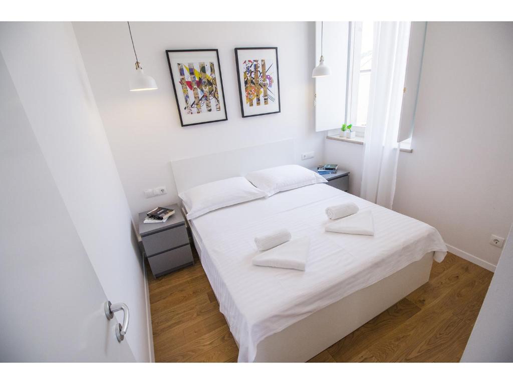 Posteľ alebo postele v izbe v ubytovaní Furioso Apartments