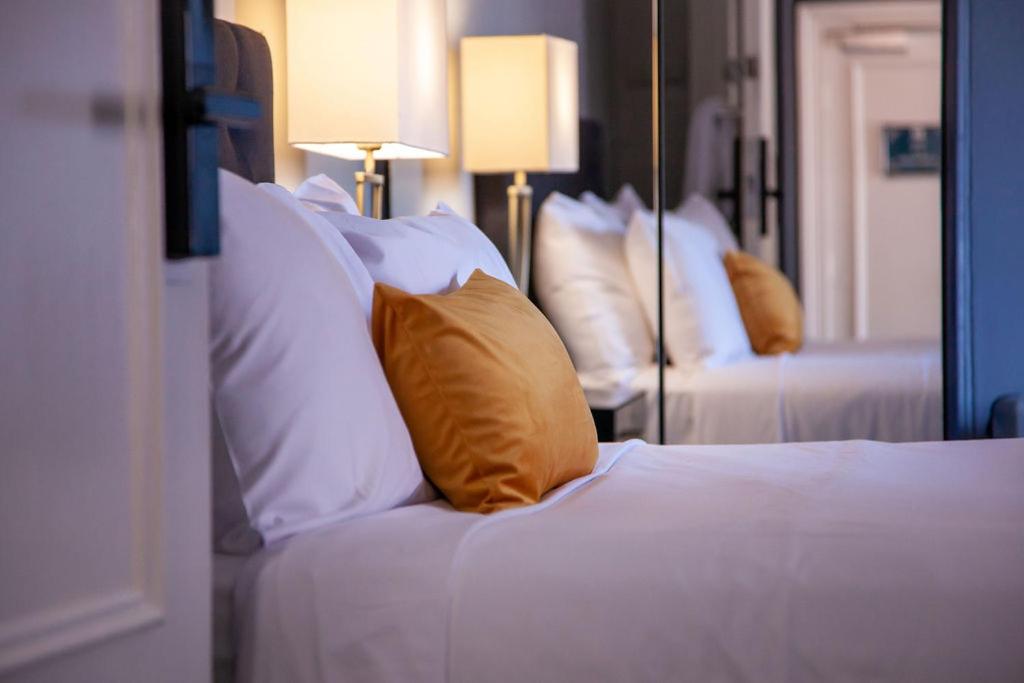 Llit o llits en una habitació de Bayswater Boutique Lodge