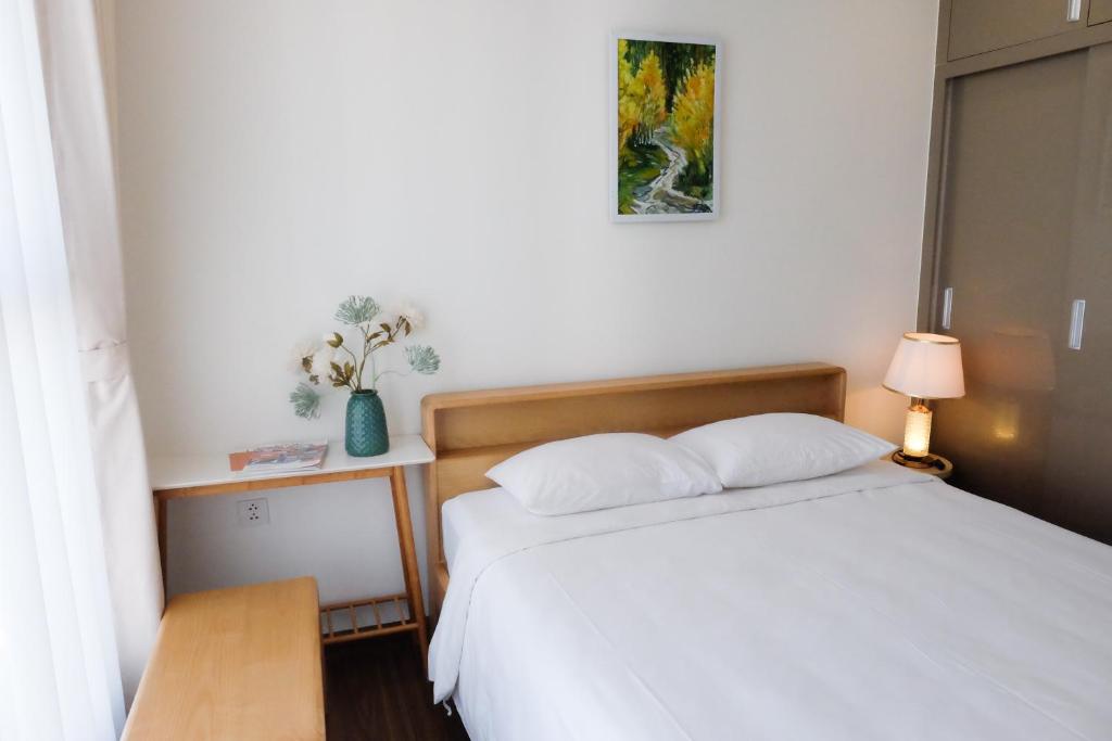Letto o letti in una camera di Aspaces Serviced Apartments - Vinhomes West Point