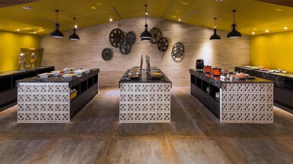 a restaurant with three tables with food on them at 凝萃文旅 台中車站店 NCH-Business Hotel in Taichung