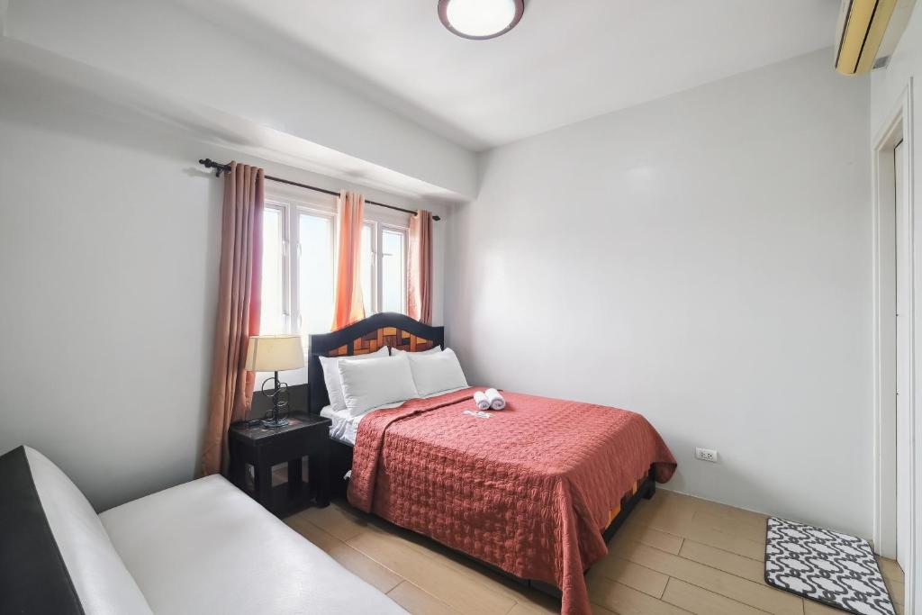 Cama o camas de una habitación en Tess and Tessha Condotel near T3 Airport
