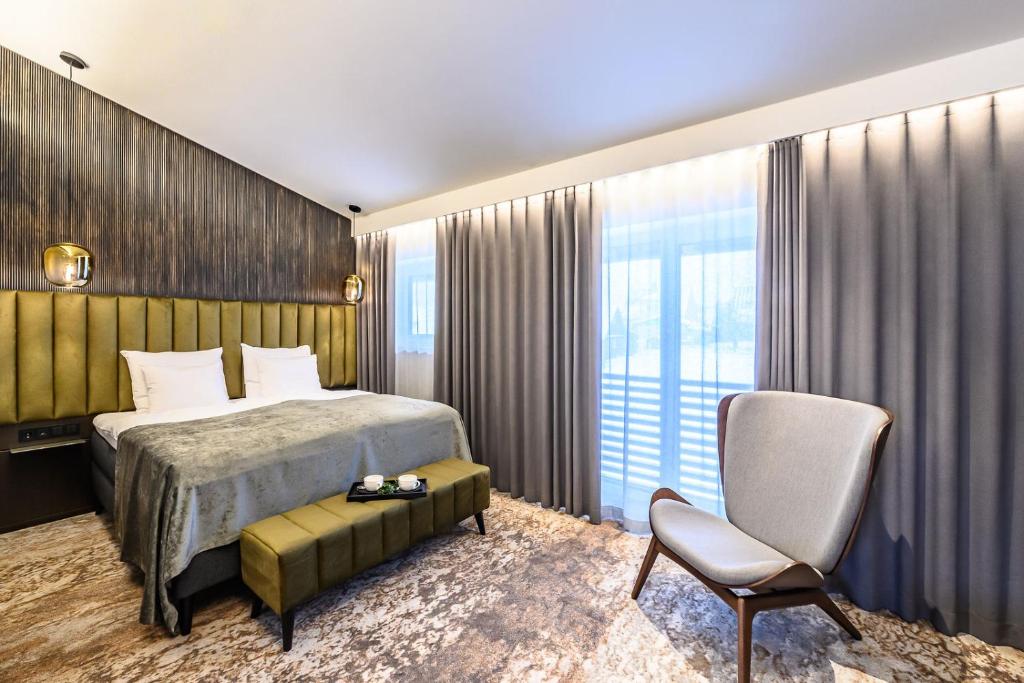 Postel nebo postele na pokoji v ubytování Ugandi Hotel