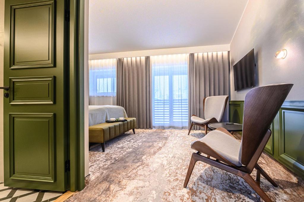 Postel nebo postele na pokoji v ubytování Ugandi Hotel
