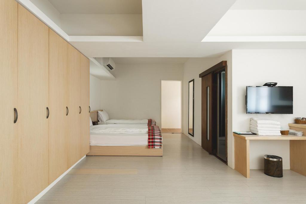 TV a/nebo společenská místnost v ubytování Tropical Low Boundary B&B
