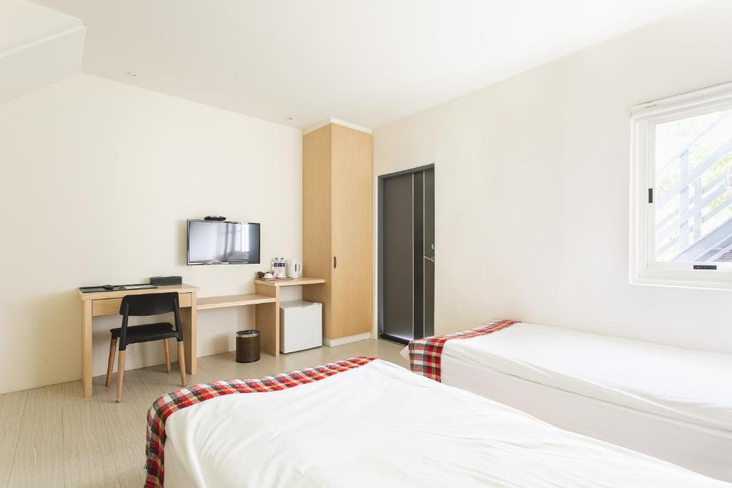 Postel nebo postele na pokoji v ubytování Tropical Low Boundary B&B