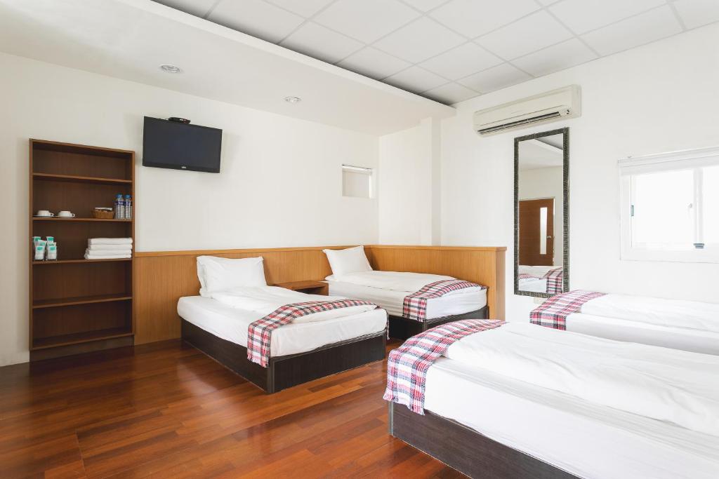 Postel nebo postele na pokoji v ubytování Tropical Low Boundary B&B