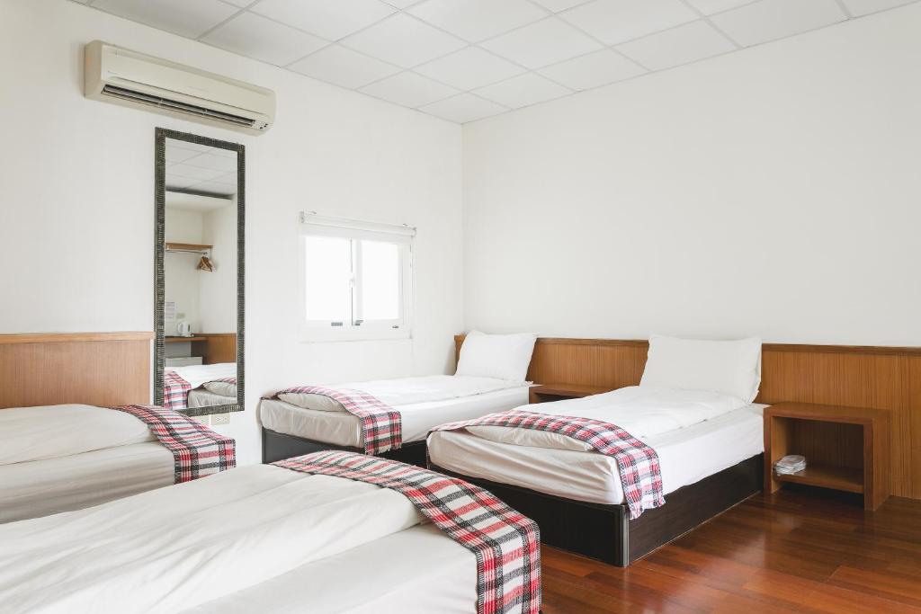 Postel nebo postele na pokoji v ubytování Tropical Low Boundary B&B