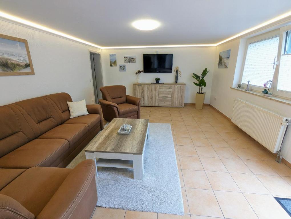 TV a/nebo společenská místnost v ubytování Ferienhaus Sellin