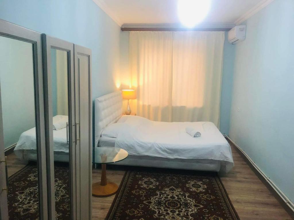 Postel nebo postele na pokoji v ubytování Center Hostel and Tours