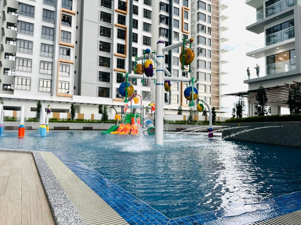 a pool with a water park with a playground at K Avenue by BeMy guest in Kota Kinabalu