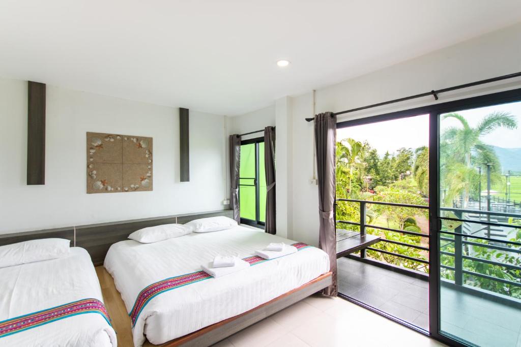 Postel nebo postele na pokoji v ubytování Sangthong Resort at Chiang Klang
