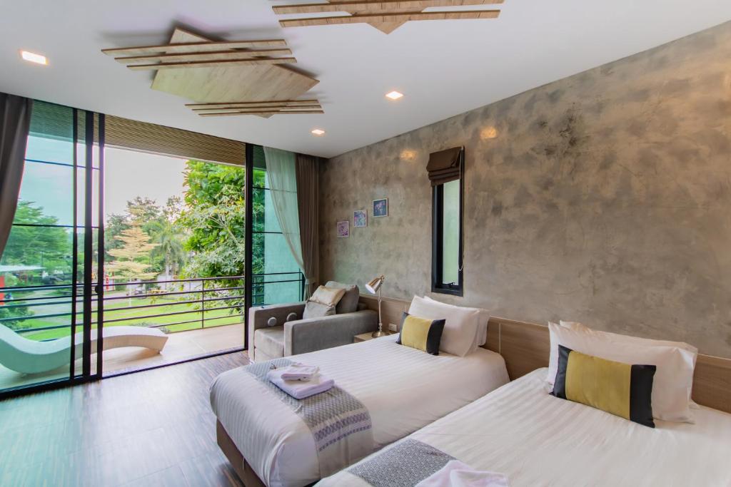 Postel nebo postele na pokoji v ubytování Sangthong Resort at Chiang Klang