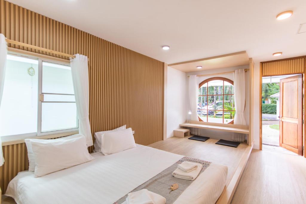 Postel nebo postele na pokoji v ubytování Sangthong Resort at Chiang Klang