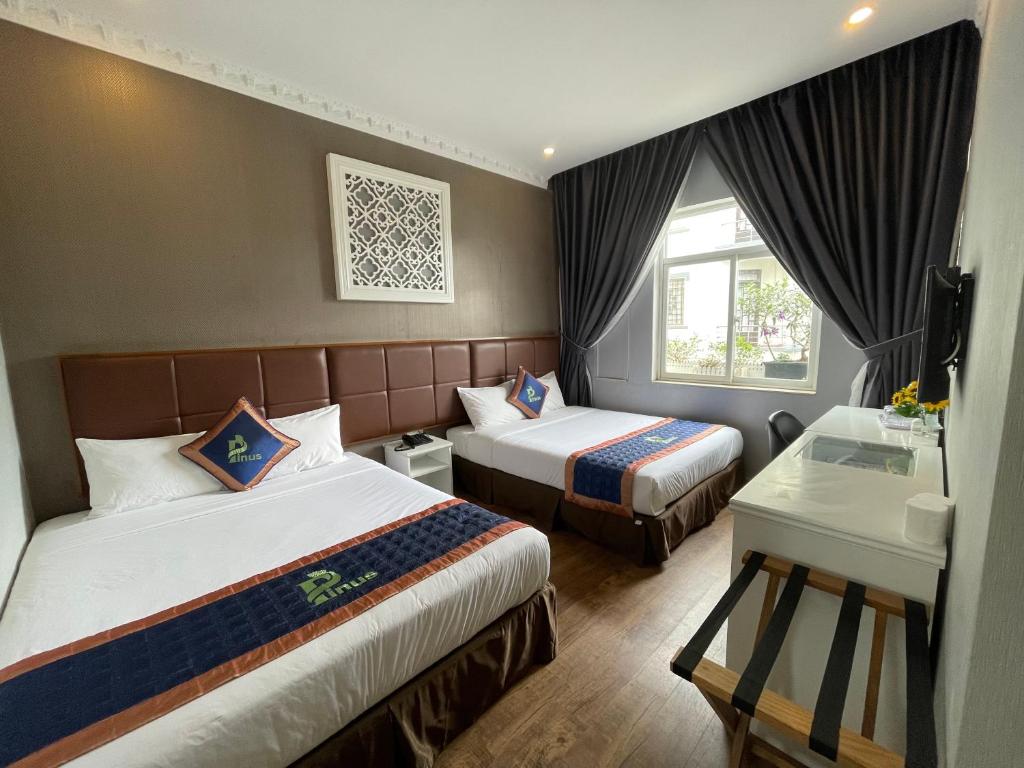 Postel nebo postele na pokoji v ubytování Pinus Hotel
