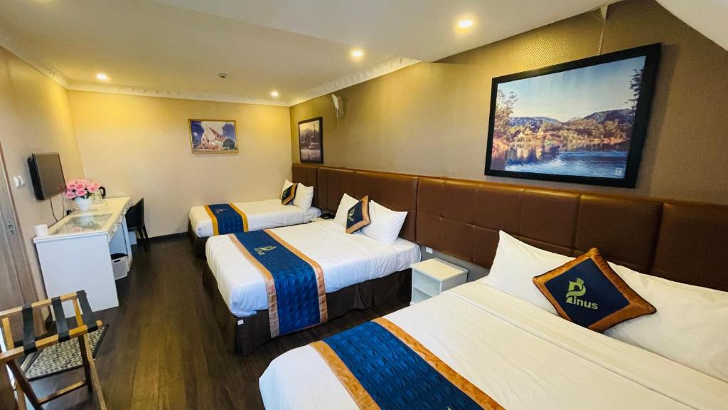 Postel nebo postele na pokoji v ubytování Pinus Hotel