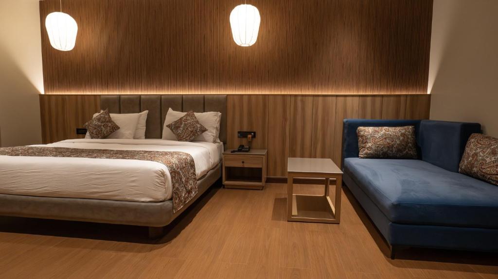 Postel nebo postele na pokoji v ubytování The Cindrella Hotel