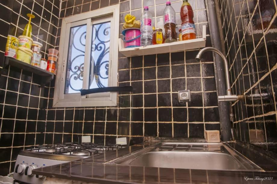 a kitchen with a sink and a window at Angelhome 