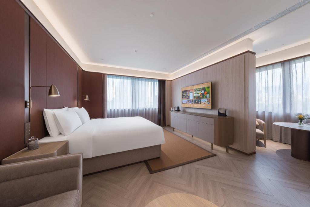 Postel nebo postele na pokoji v ubytování Crystal Orange Hotel - Shenzhen Nanshan Xinhaofang Branch