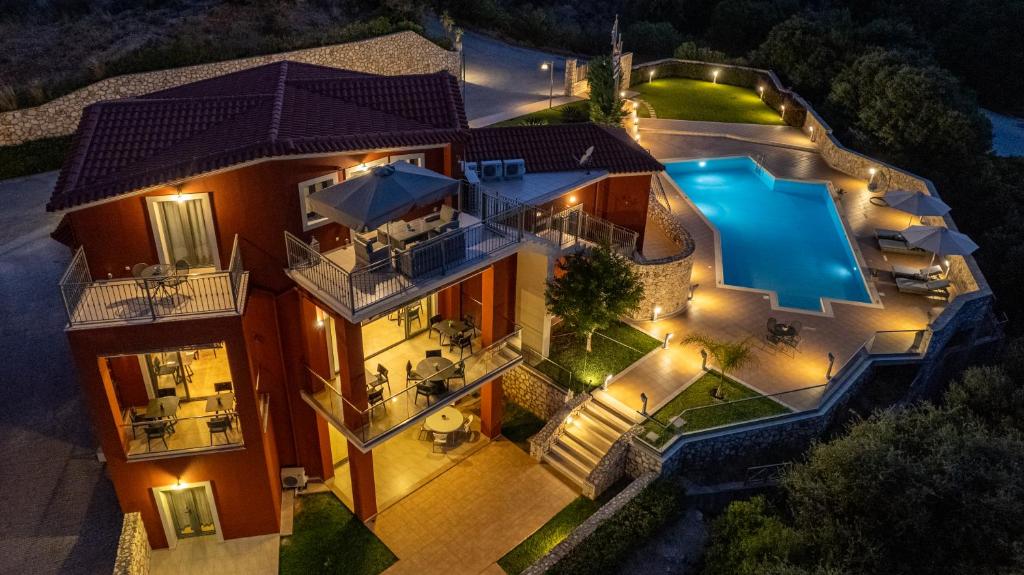 an aerial view of a house with a swimming pool at Crystal Palace - Luce in Skala Kefalonias