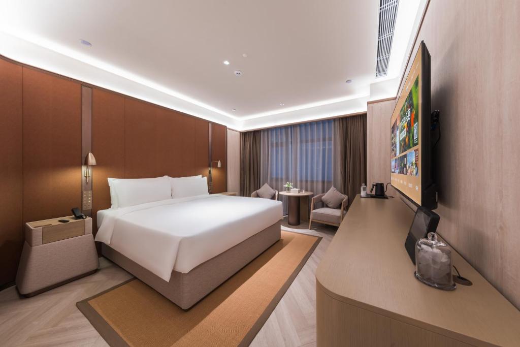 TV a/nebo společenská místnost v ubytování Crystal Orange Hotel - Shenzhen Nanshan Xinhaofang Branch