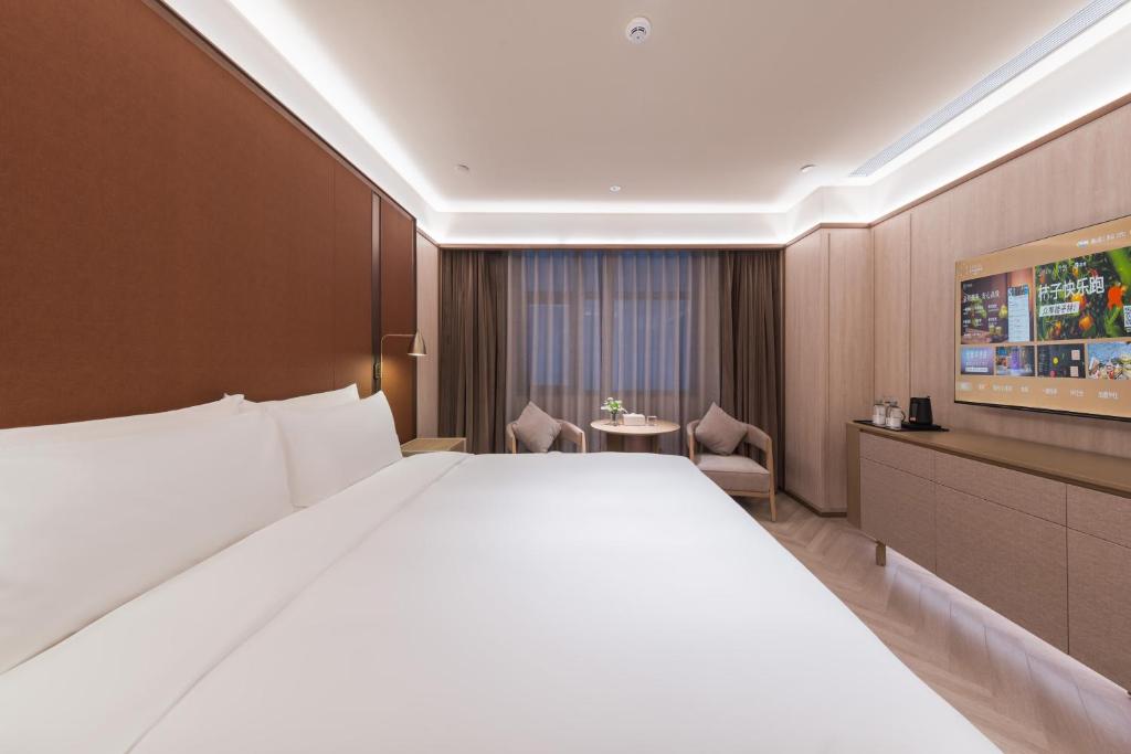 Postel nebo postele na pokoji v ubytování Crystal Orange Hotel - Shenzhen Nanshan Xinhaofang Branch