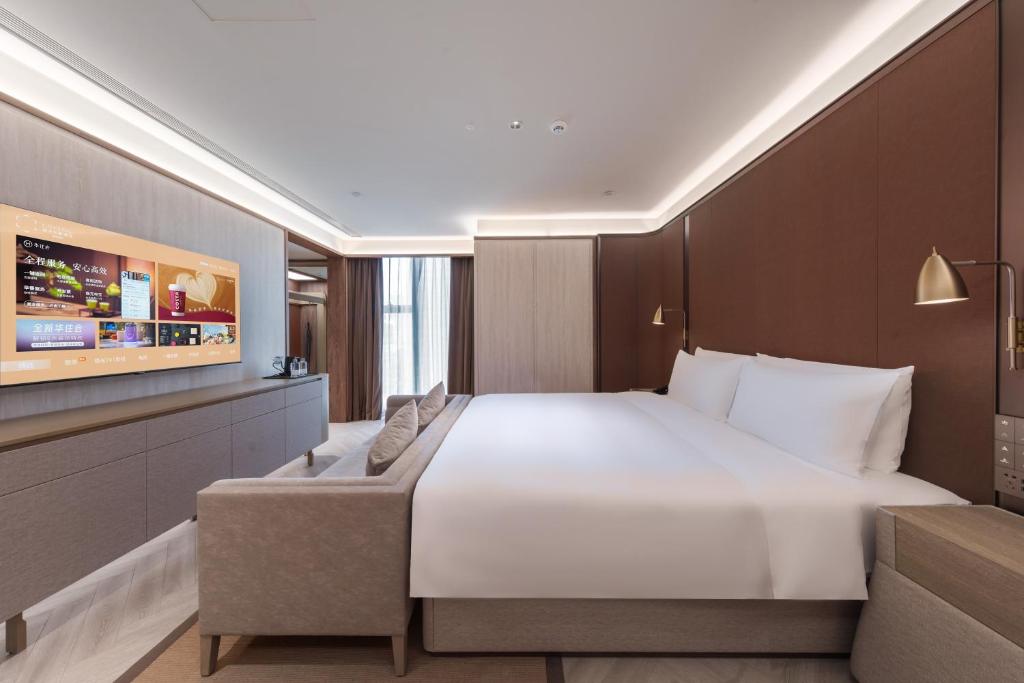 Postel nebo postele na pokoji v ubytování Crystal Orange Hotel - Shenzhen Nanshan Xinhaofang Branch