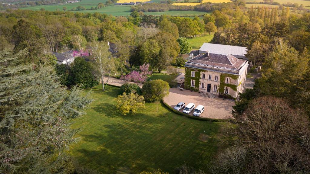 an aerial view of a large house in a field at INSTITUT BOIS ROBERT in Bécon-les-Granits