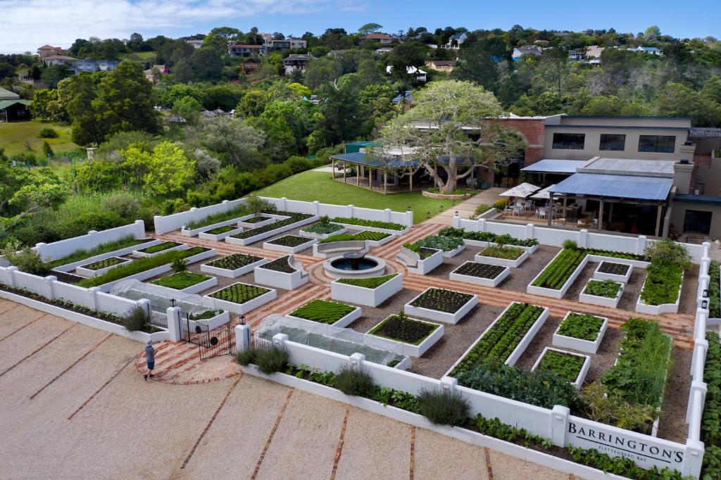 an aerial view of a garden in front of a building at Barrington's in Plettenberg Bay