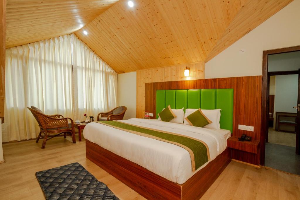 Postel nebo postele na pokoji v ubytování Tripli Hotels Drilbu Manali