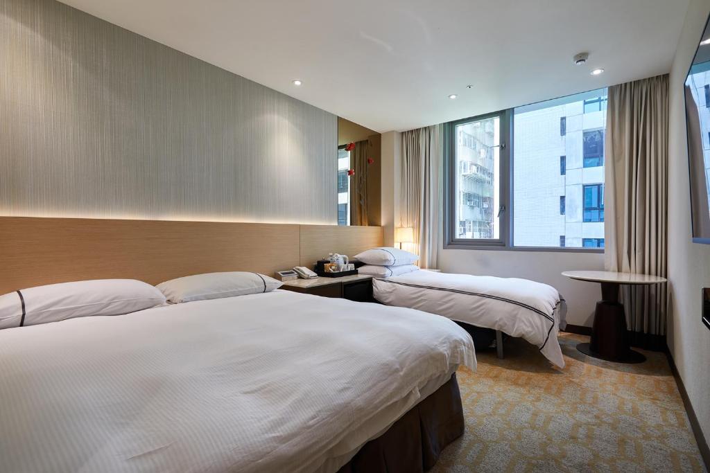 Postel nebo postele na pokoji v ubytování K Hotel Tianjin