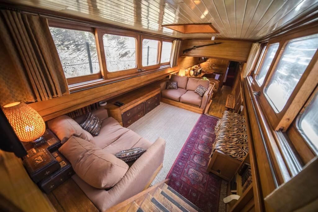 an overhead view of a living room in a train car at Classic riverboat in the center of Paris in Paris