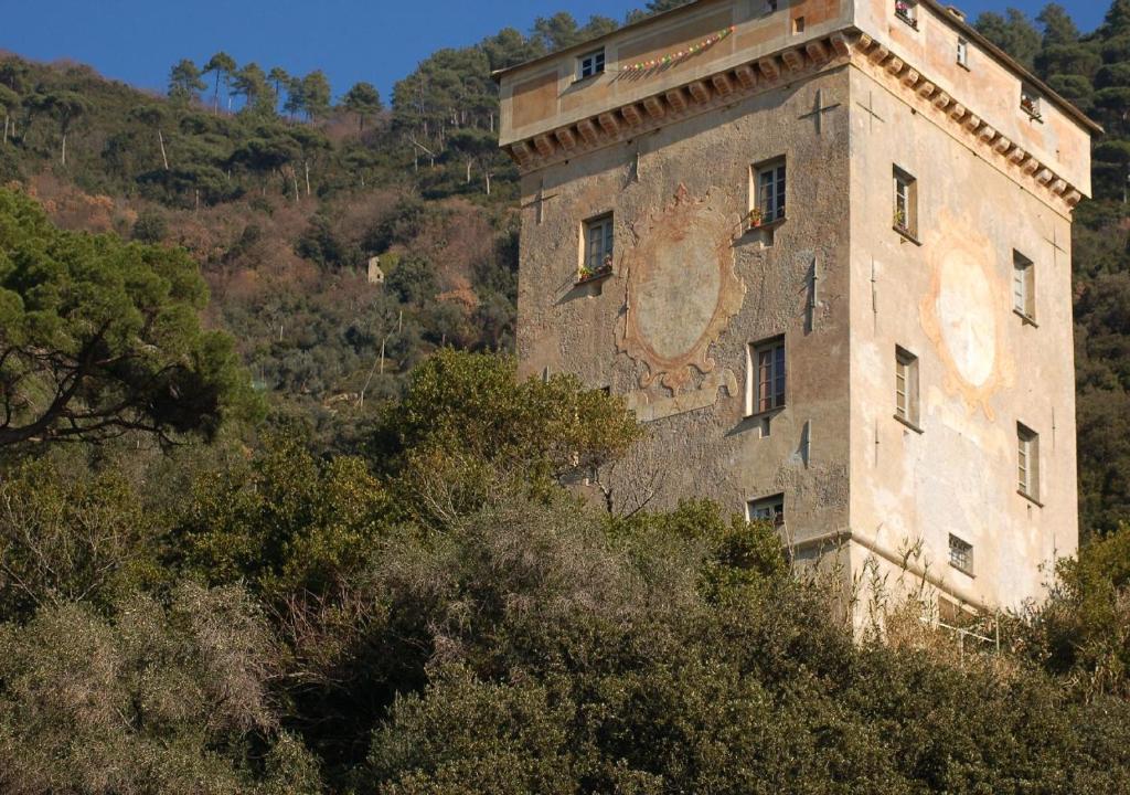 an old building on the side of a hill at Casa dell'Arco 31 in Camogli