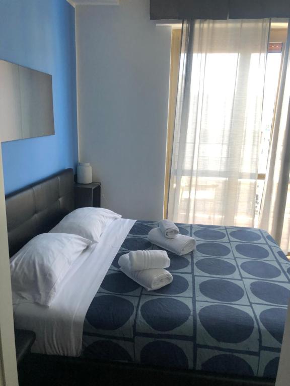 Łóżko lub łóżka w pokoju w obiekcie Marina SKY 8