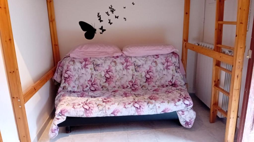 En eller flere senge i et værelse på La casetta di Helen