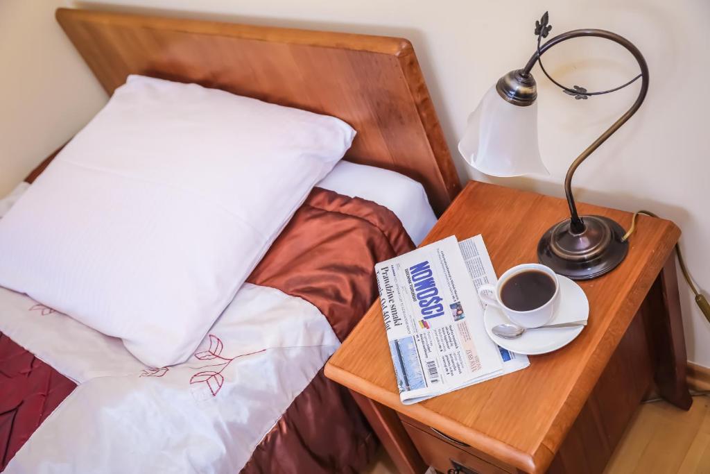 Postel nebo postele na pokoji v ubytování Hotel Uniwersytecki