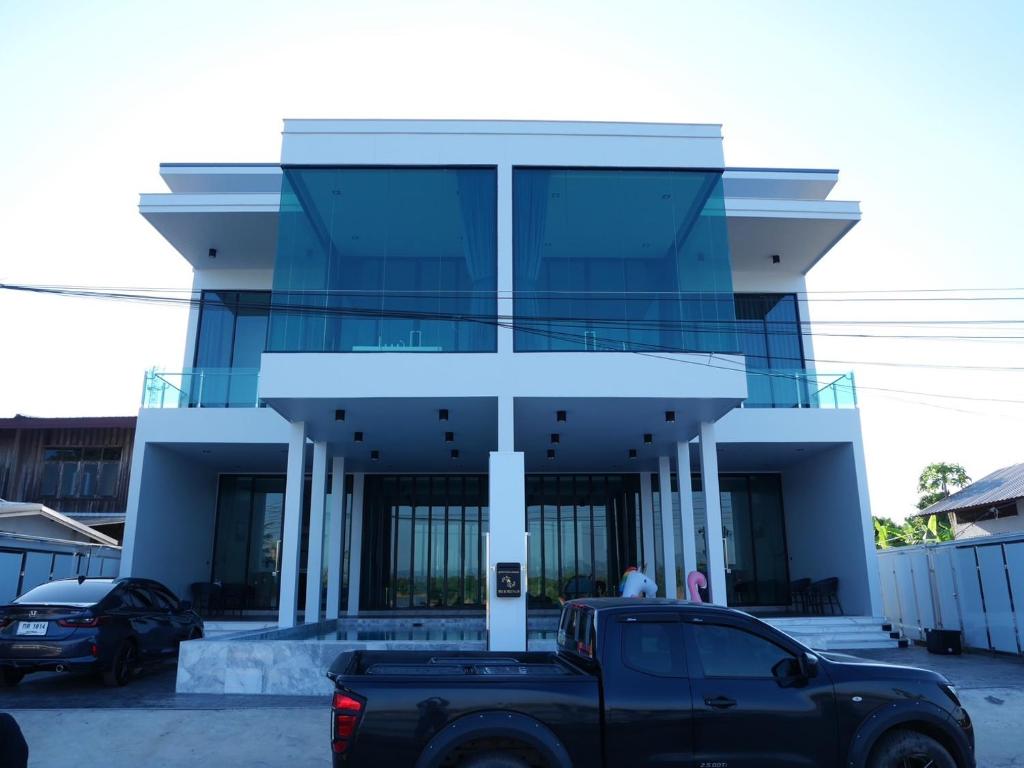 a truck parked in front of a building at Pool Villa Rimkhong Nakhorn Panom 