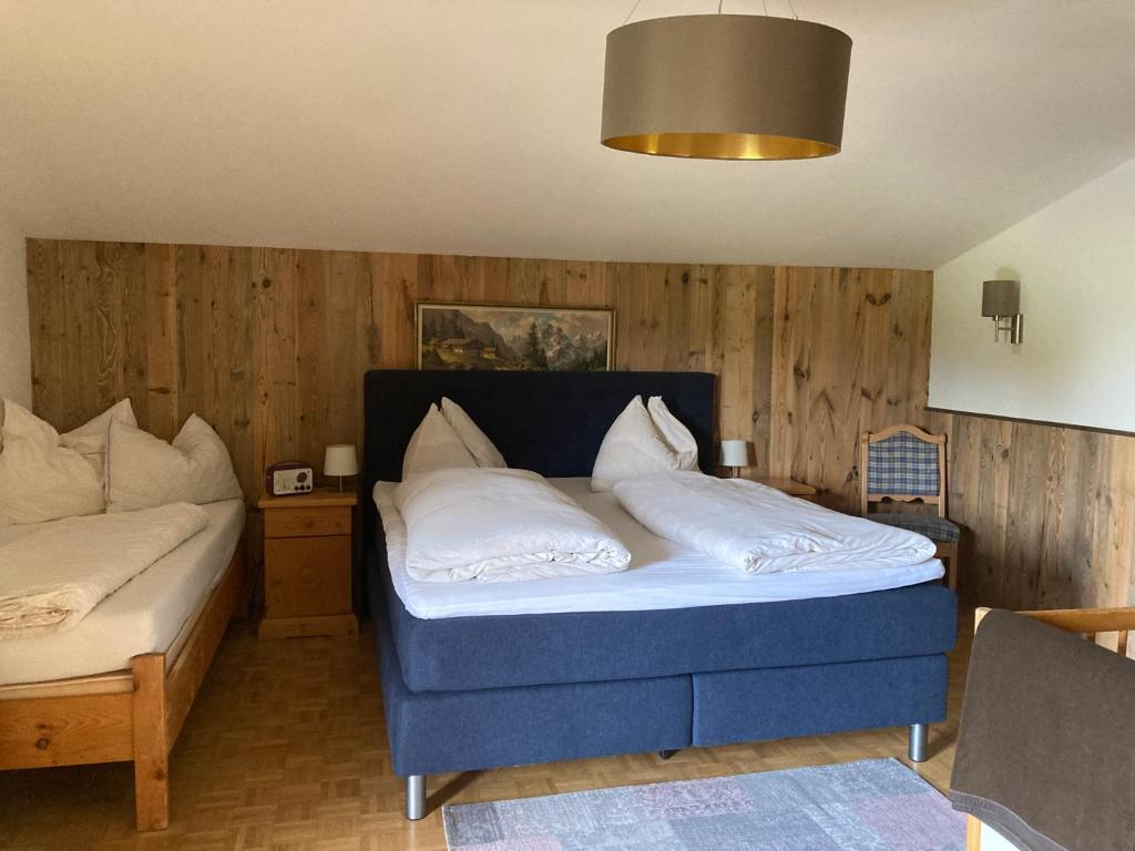 Postel nebo postele na pokoji v ubytování Ferienhaus Schnitzhof