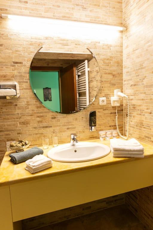 Koupelna v ubytování Hotel Max Inn