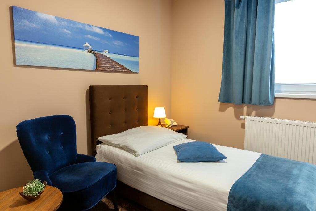 Postel nebo postele na pokoji v ubytování Hotel Max Inn