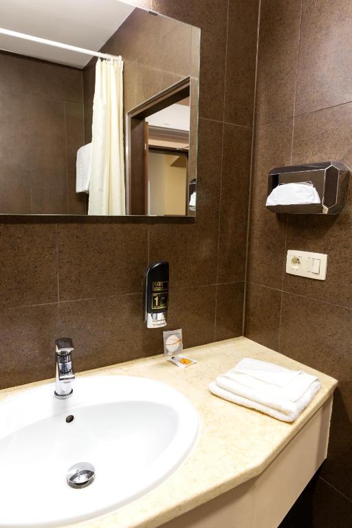 Koupelna v ubytování Hotel Max Inn