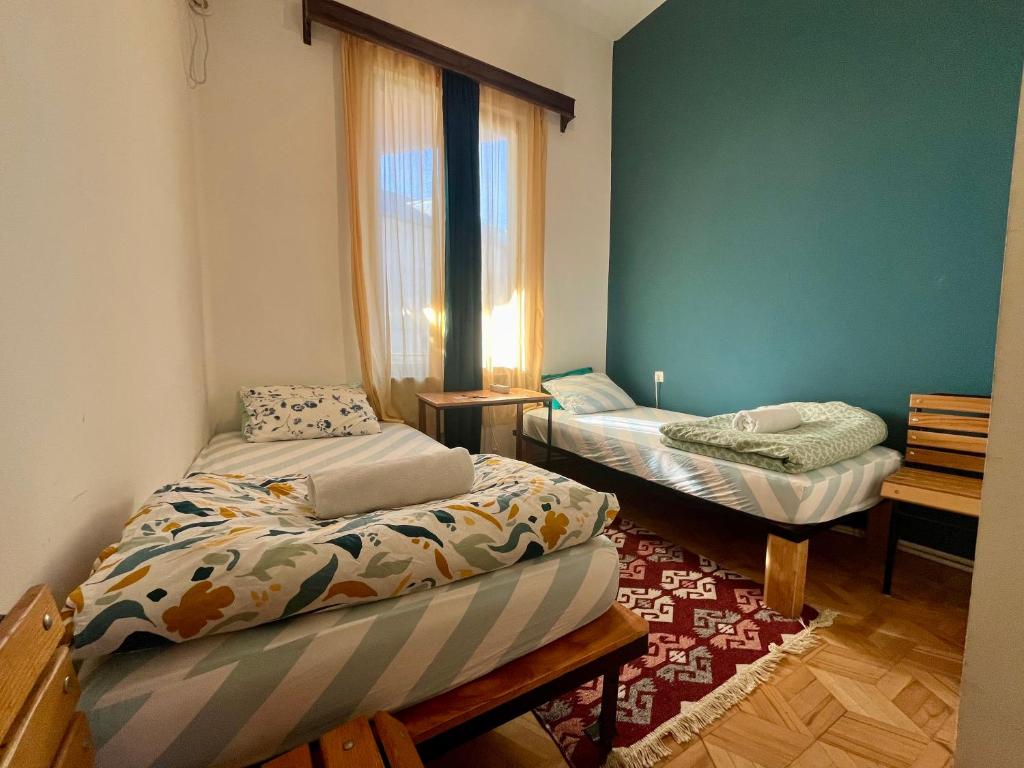 Postel nebo postele na pokoji v ubytování Bao Hostel Kutaisi