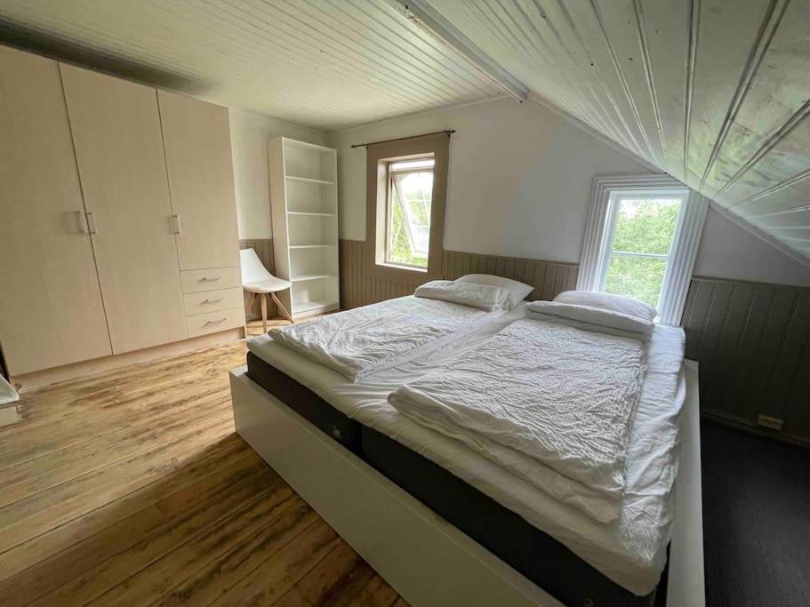 a bedroom with a large bed in a room at Nordland House-Breathtaking View-Central Location in Sortland