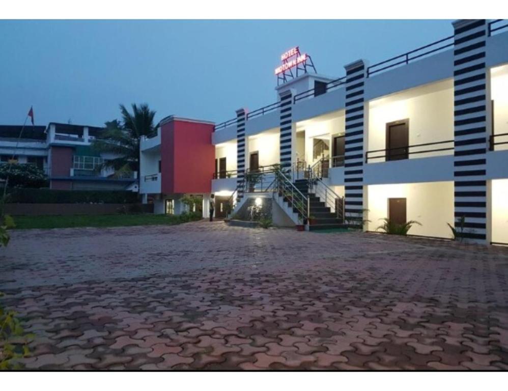 a building with a staircase on the side of it at HOTEL MIDTOWN INN, Singrauli in Singrauli