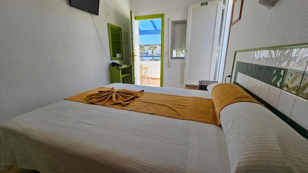 Postel nebo postele na pokoji v ubytování Hotel El Puntazo I